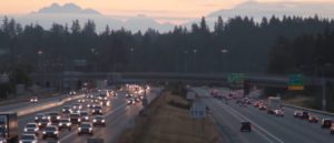 Traffic on Interstate 5 in Washington state. Mountains in distance.